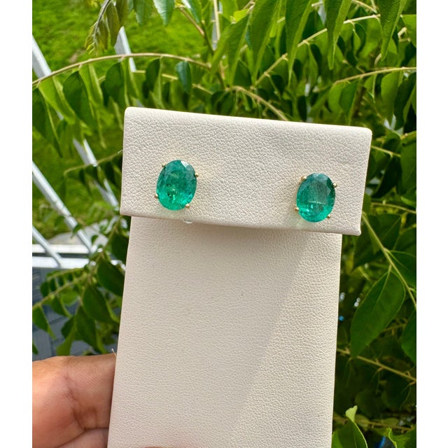 3 Carat Oval Natural Emerald Stud Post Earrings 14 Karat Yellow Gold Two emerald weighing approximately 3 carats Total...