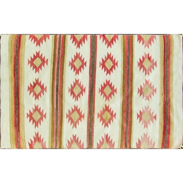 A very attractive antique Navajo handwoven rug featuring a wonderfully simple and graphic banded geometric composition....