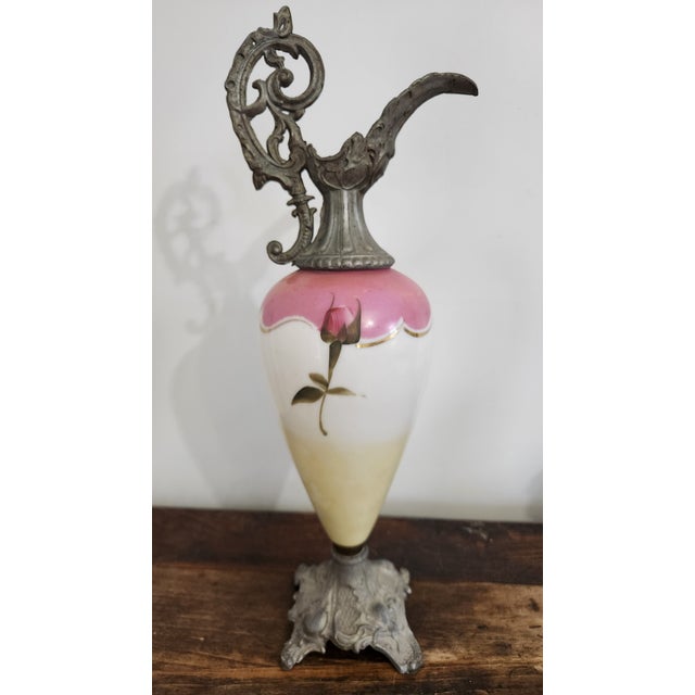 An impressive late Victorian to Edwardian decorative porcelain mantel ewer, circa 1890–1915, featuring romantic floral...