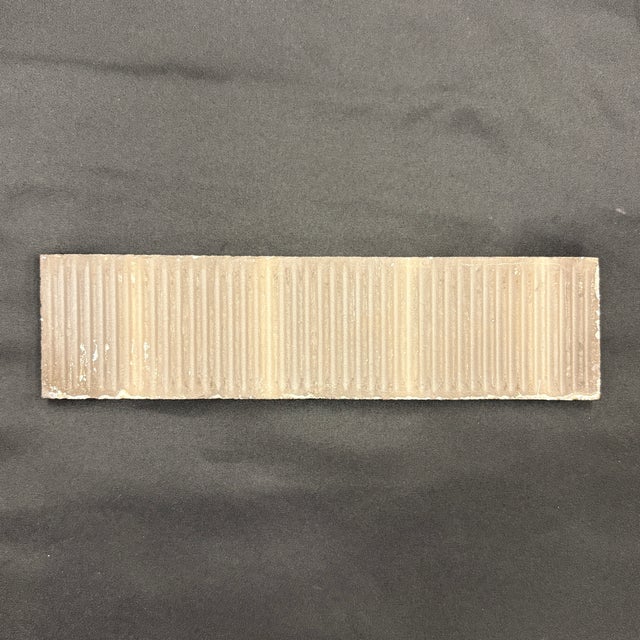 2" x 8" ceramic filed tile with a white glaze and a glossy crackled finish. Tiles are handmade and hand glazed, some...