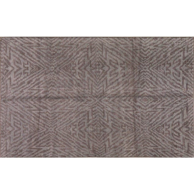 Hand-knotted with care using traditional rug-making techniques, this wool rug blends timeless craftsmanship with a modern...