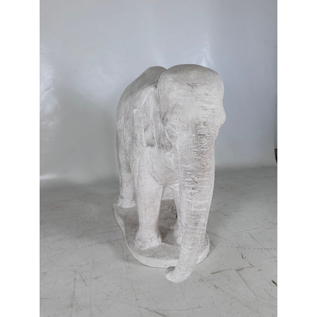 Large vintage plaster elephant sculpture. Signed on the base, this piece is highly decorative and realistic. It's...