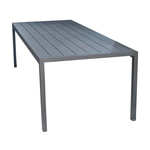 A Vintage Restoration Hardware Modern Outdoor Table in Aluminum. The Legs may be removed for Shipping/ storage.
