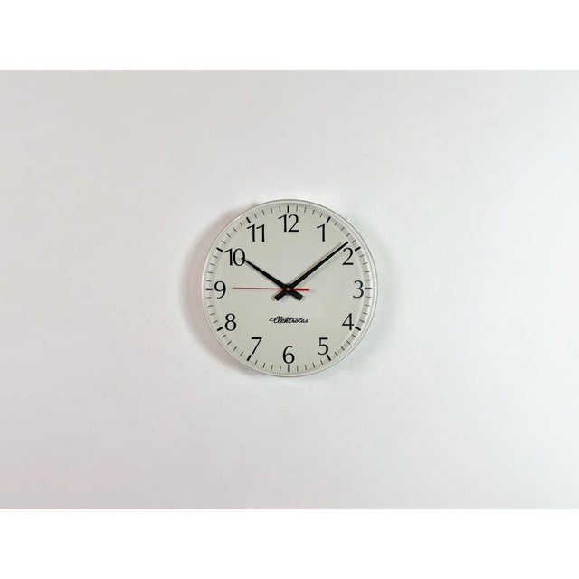 Industrial wall clock was produced by Elektročas in Czech republic during the 1990s. It features a white plastic dial and...