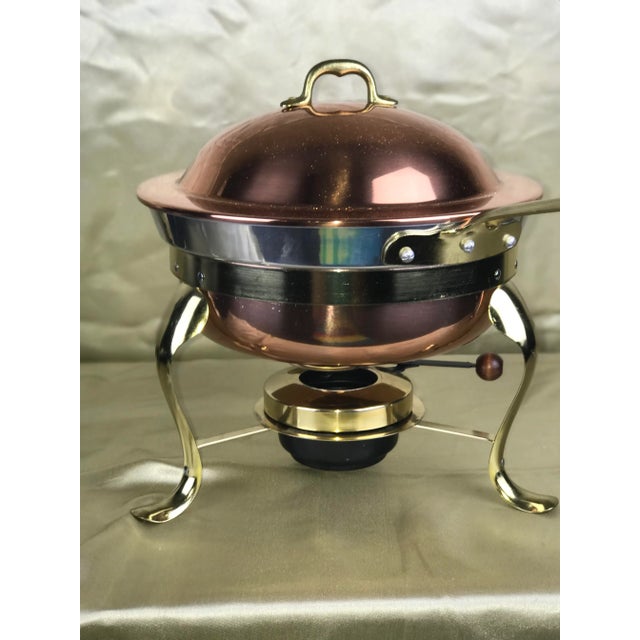 Vintage MCM copper and brass chafing dish on stand. Features long brass handle (rare) to keep your fingers safe from...