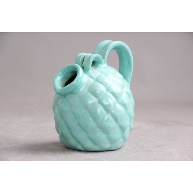 Michael Andersen pineapple-shaped jug with spout and handle. Light green glaze. The jug is in good condition and...