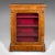 This is an antique pier cabinet. An English, walnut and boxwood glazed bookcase or display cupboard, dating to the Regency...