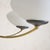 An Italian chandelier from the 1950s, crafted in the manner of Stilnovo. The composition feels architectural: slim brass...