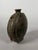 Green-glazed earthenware Bianhu flask of a nomadic horseman, China, Tang Dynasty (618-907). This piece, made of monochrome...