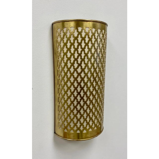 Elevate your space with a stunning, handcrafted Moroccan wall sconce or lantern. Made of top-quality brass, its semi-...