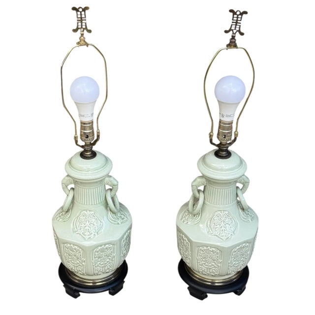 Pair of vintage Chinese celadon table lamps. Two elephant handles with rings. Octagonal shape with ornamented panels. All...