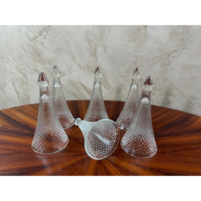Set of 6 champagne glasses called trinquettes or cul sec. At their base, they are marked "Henri Maire", famous French...