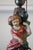 Colorful antique chalkware lamp from the 1930s of a lady carrying a pot. Original cord and pull chain. No major condition...
