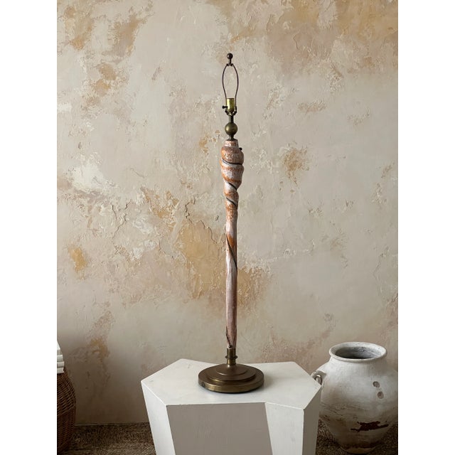 Vintage floor lamp with unique sculpted wood pole and solid brass hardware.