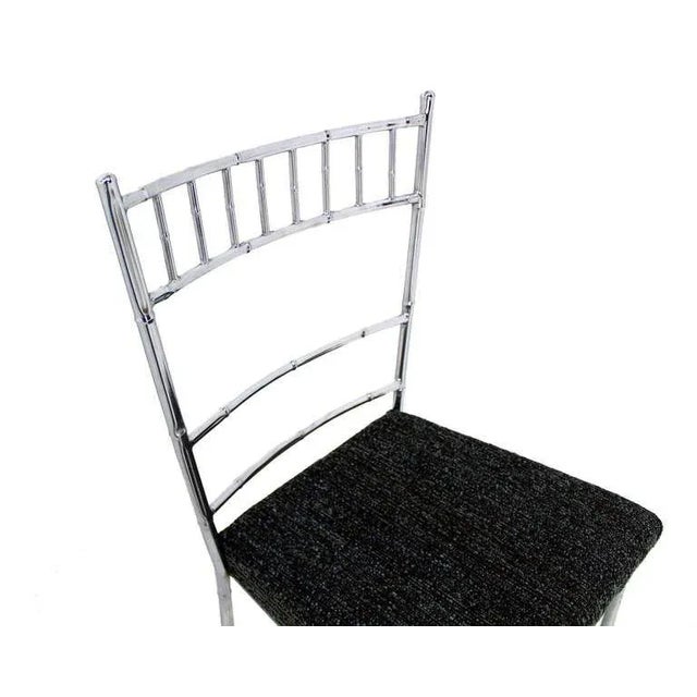 Nice set of four faux bamboo dining chairs. Newly upholstered seats.