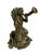A fantastically detailed bronze mermaid woman seated upon a large tortoise. She appears to be playing a musical...