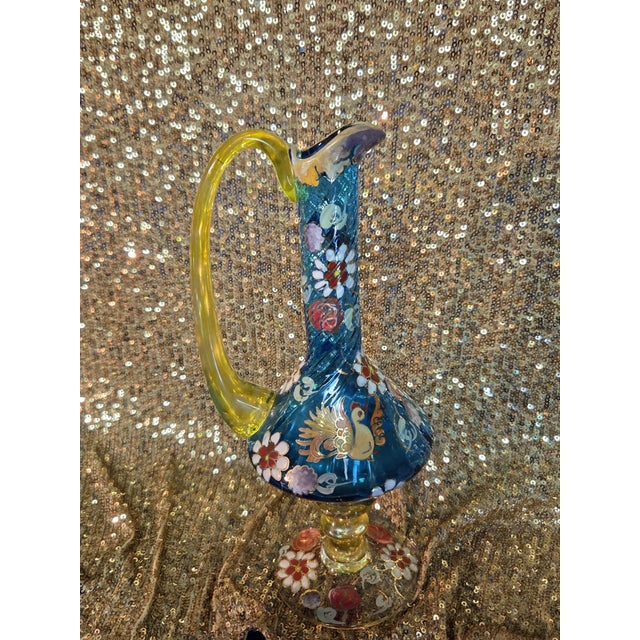 Rare find! Fabulous multi-colored ewer/vase. Made of polychrome blown glass with hand-painted flowers and birds, with gold...