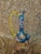 Rare find! Fabulous multi-colored ewer/vase. Made of polychrome blown glass with hand-painted flowers and birds, with gold...