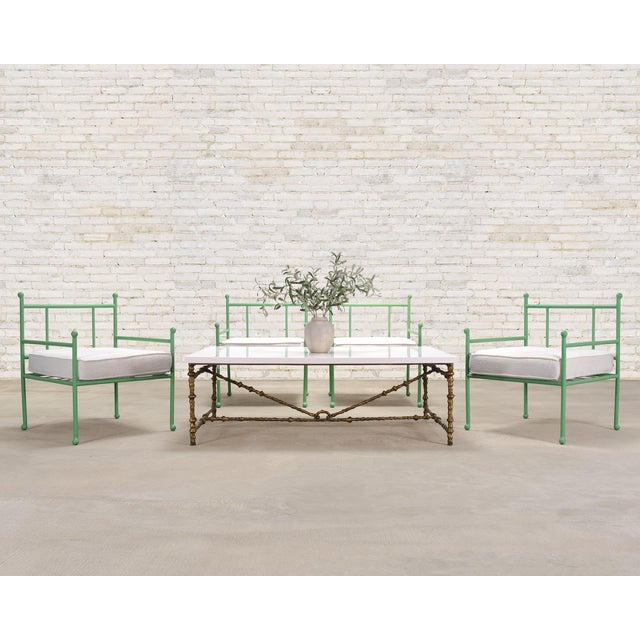An elegant gilded iron faux bois branch "Diego" coffee or cocktail table made by Oly Studio San Francisco, California. The...