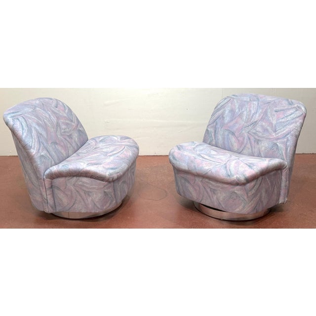 Pair of Directional Swivel Lounge Chairs on Polished Stainless Bases, 1990 A documented pair of Directional swivel lounge...