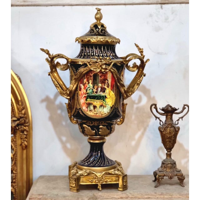Make a statement with this magnificent French-inspired porcelain vase, featuring a dramatic black finish, elaborate gilded...