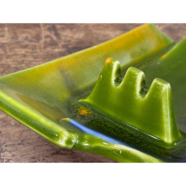 Mid century modern California art pottery ashtray marked “Calif USA,” featuring a rectangular form with integrated...