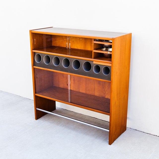 Restored mid century modern freestanding teak dry bar by Heltborg Mobler, made in Denmark c. 1960s. The service side...
