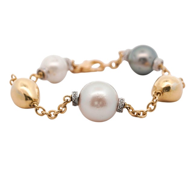 Vintage 18K yellow gold station bracelet featuring mixed cultured South Sea and cultured Akoya pearls with diamond pave...