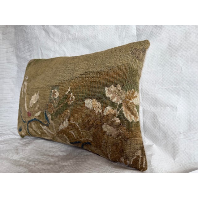 This 17th century Brussels tapestry pillow features a classic Baroque floral composition, woven with softly defined...