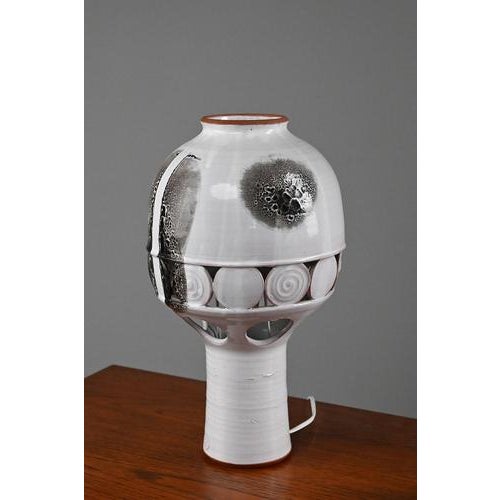 Gorgeous handmade lamp in a large size. This ceramic lamp is marked with a mark unknown to us. We only know it is made in...