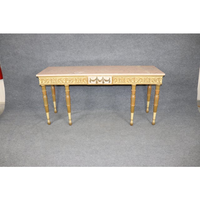 Dimensions: 33.25 inches high x 69 inches wide x 21.5 inches deep Elevate your interior with this exquisite vintage French...