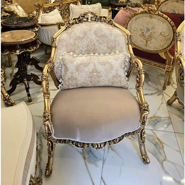 Bring timeless French elegance into your home with this beautifully crafted Louis XV-style armchair, featuring luxurious...