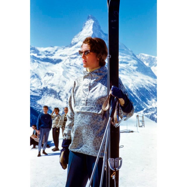 Stylish Skiing by Toni Frissell A stylish skier prepares for her journey down a mountain in Zermatt, Switzerland, 1956....