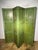 An exceptional and rare four-panel screen featuring an Arte Povera (or Lacca Povera) design on an antique green lacquer...