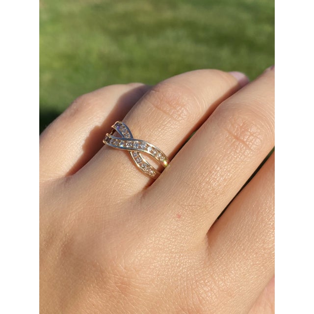 The Etolin: Ladies 14K Gold Crossover Diamond Band. Crafted in 14 karat yellow gold, this ladies' band features a...