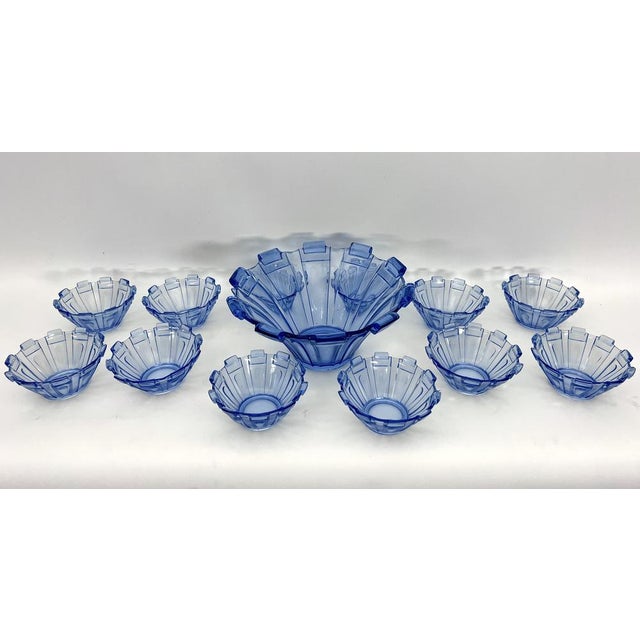 This set of a bowl and 12 cups is made from blue murano glass and was produced in italy during the 30s in art deco style....