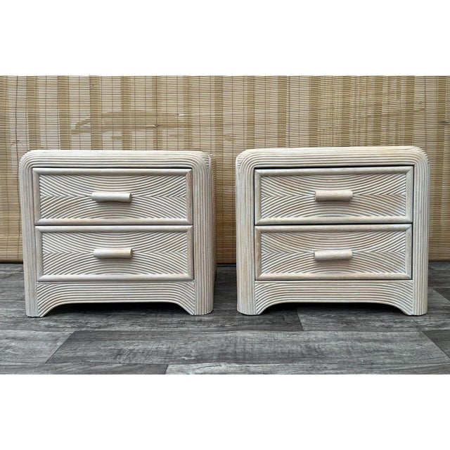 A Pair of Coastal Style Split Reed Rattan Nightstands in the Gabriella Crespi's Manner. Circa 1980s. Feature a chic rattan...
