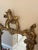 A striking late 19th-century Rococo Revival wall mirror featuring an exceptionally ornate, sculptural frame with an aged...