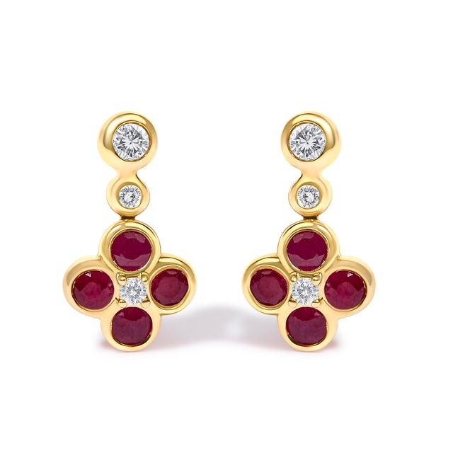 Imbue your presence with a whisper of regal charm with these exquisite 14K yellow gold dangle earrings, where the...