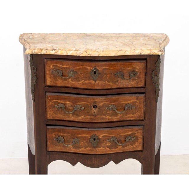 Louis XV Style Marble Top Mahogany Chest of Drawers, the three drawers with marquetry inlay and bronze mounts to sides and...