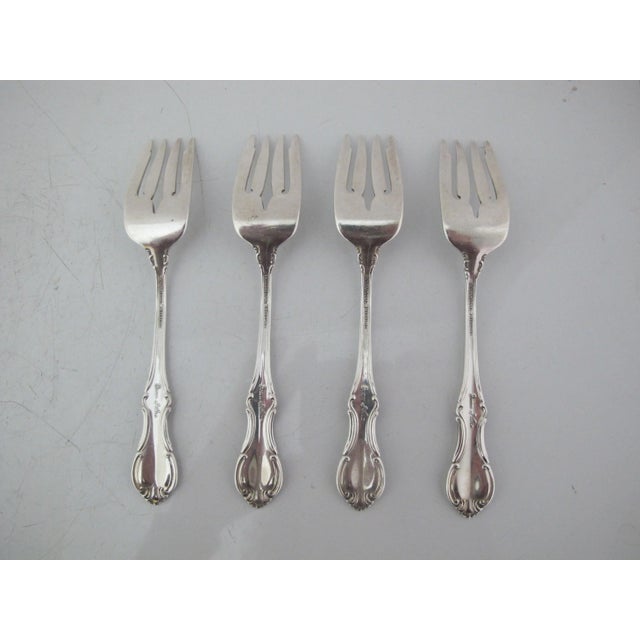 International sterling silver Joan of Arc pattern salad fork set of 4. Each with 4 tines. Each measures 6 1/8". Excellent...