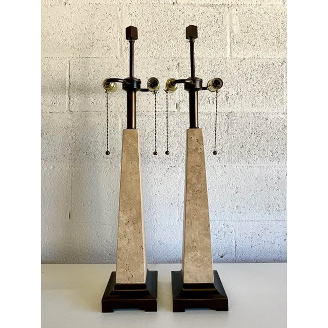 Exceptional pair of vintage table lamps featuring tall, tapered obelisk-form bodies crafted from richly textured natural...