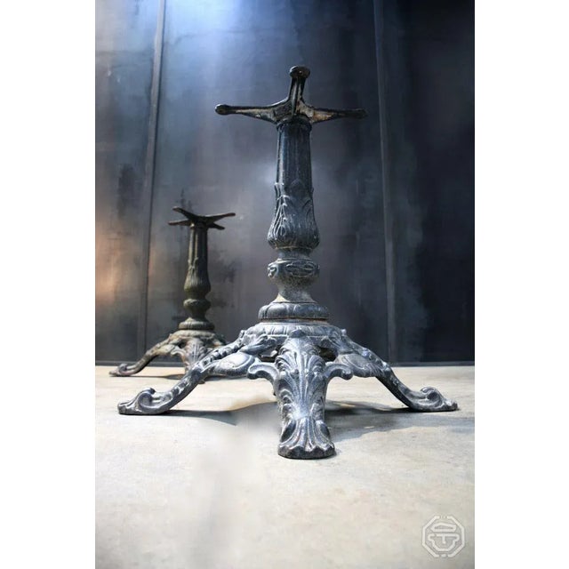 Pair of old cast iron legs of bistro tables, early 20th century