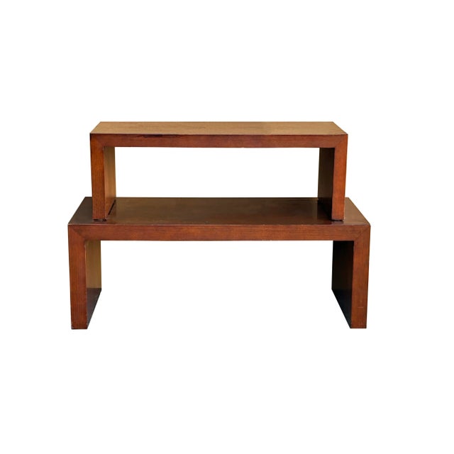 Set of 2 simple plank wood rectangular nesting coffee tables, finished in a rich brown tone. These minimalist tables offer...