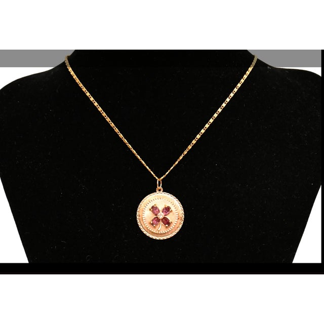 Vintage 14K gold pendant charm featuring a layered concentric circular design with intricate engine-turned and diamond-cut...