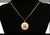 Vintage 14K gold pendant charm featuring a layered concentric circular design with intricate engine-turned and diamond-cut...