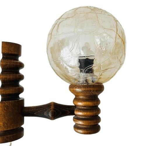 Vintage mid-century wall lamp made of solid wood with a beautiful iridescent peach-colored glass globe from the 1970s. The...