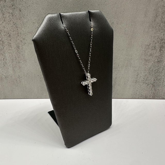 This elegant diamond cross necklace in 14kt white gold features 0.50 carats total weight of natural GH SI2–I1 round...