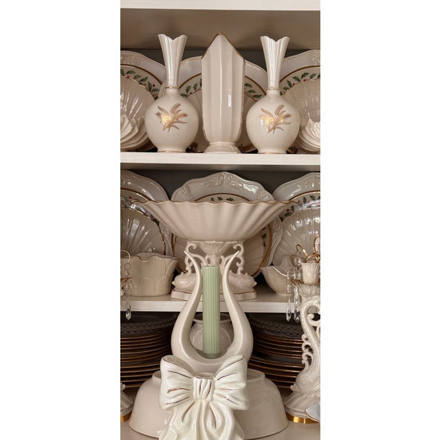 Here is a pair of excellent condition harvest themed sheaf of wheat porcelain vases by the timeless, classic American...