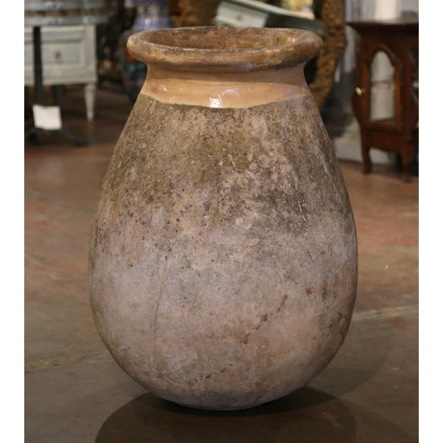 This substantial antique olive oil jar brings authentic Provençal character and sculptural presence to an interior,...